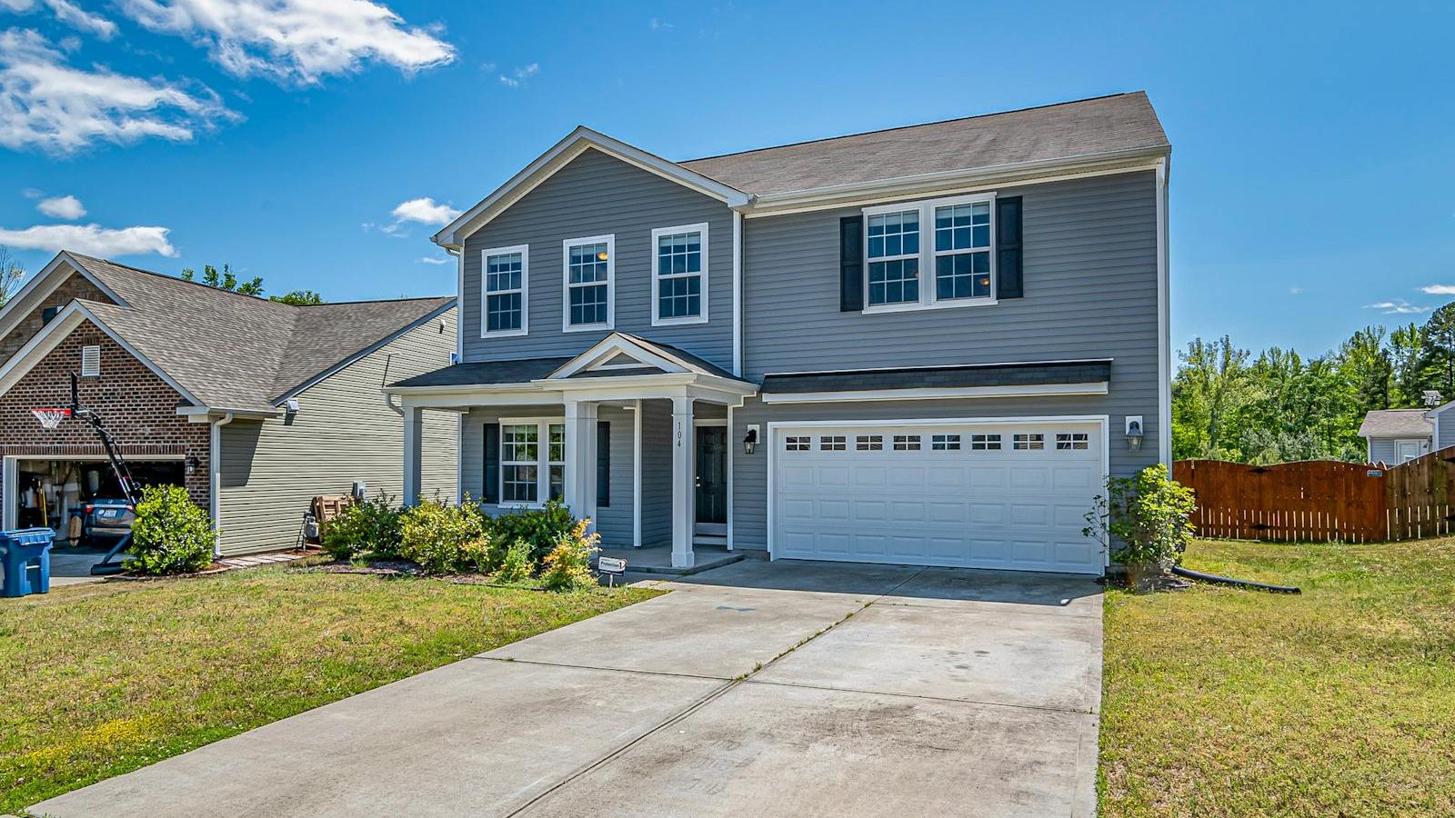 Coastal Hampton Roads home with a prominent two-car garage, the kind of property at the center of the 2026 insurance pullout