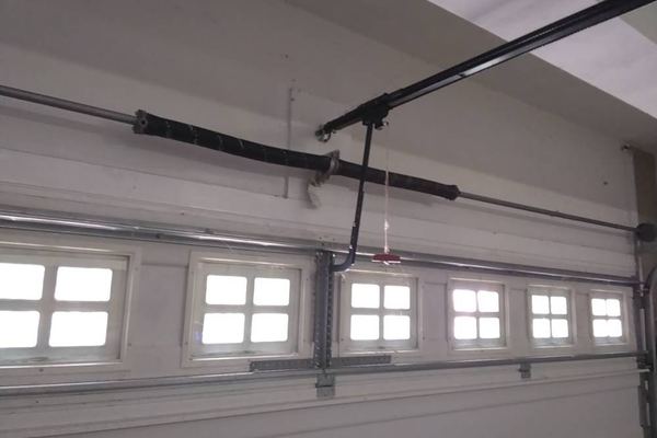 Garage door spring repair in Suffolk VA finished: a new matched pair of 207-wire torsion springs installed on the shaft of the North Suffolk door