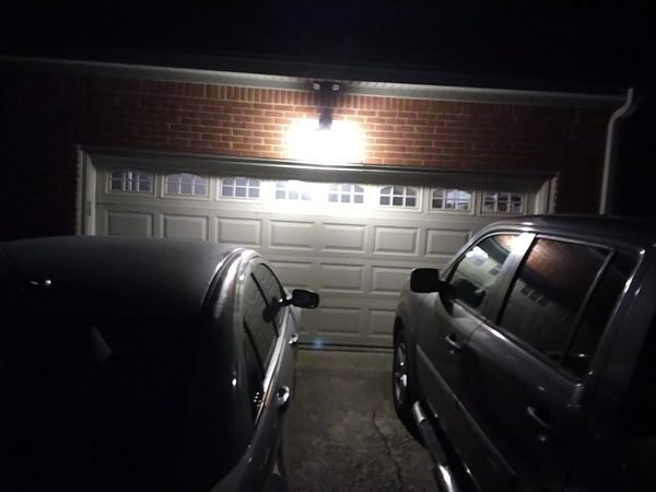 Garage door closed at night after a midnight emergency repair in Portsmouth