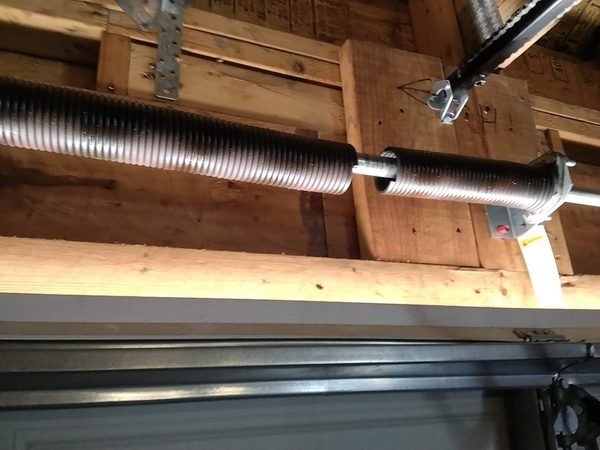 Garage door repair in Norfolk VA: broken torsion spring with the gap in the coils, ZIP 23518, June 2026
