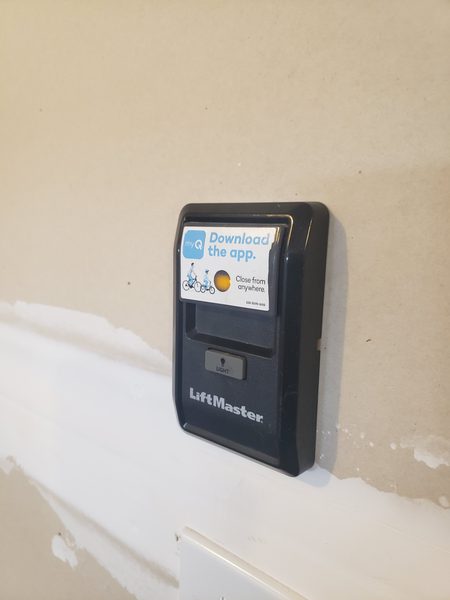 Garage door opener wall console and wiring checked during a phantom-opening diagnosis at a Virginia Beach 23454 home