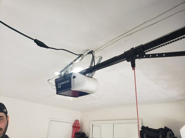 Garage door opener mounted to ceiling